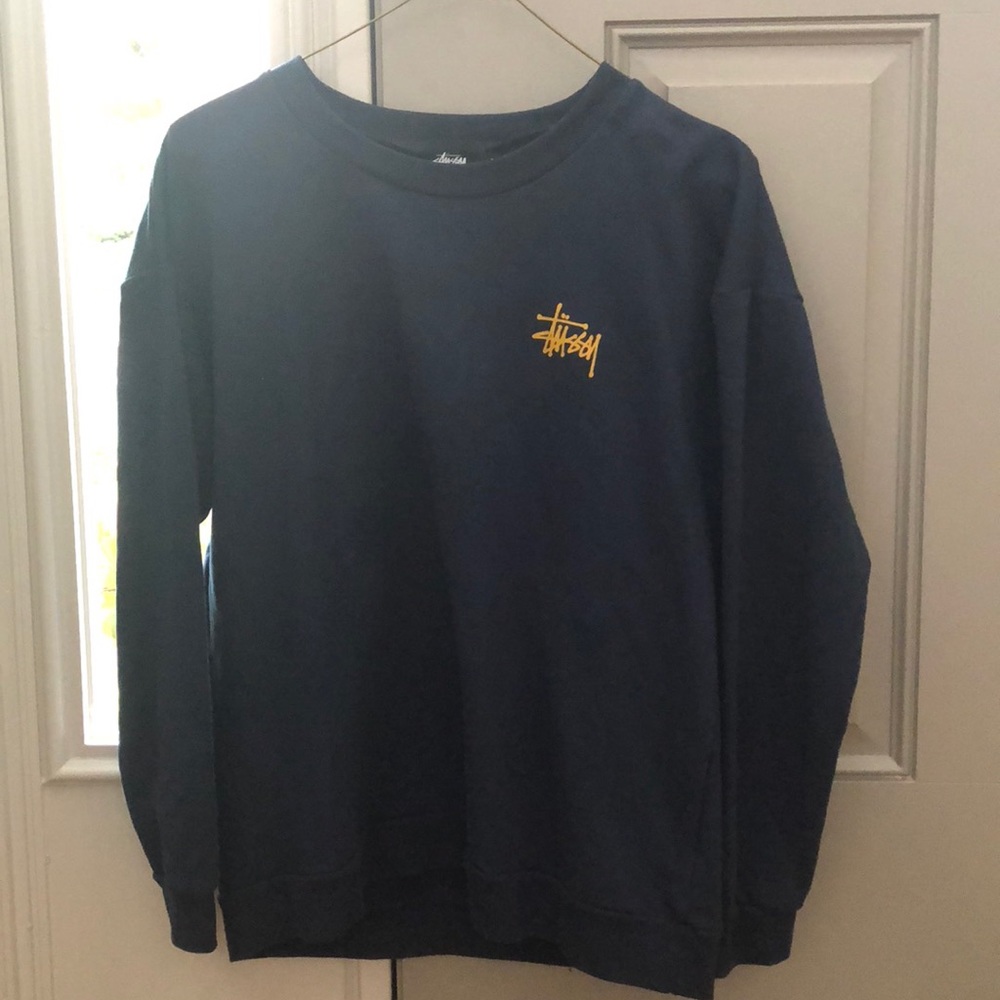 Small navy women’s Stussy sweat shirt.
